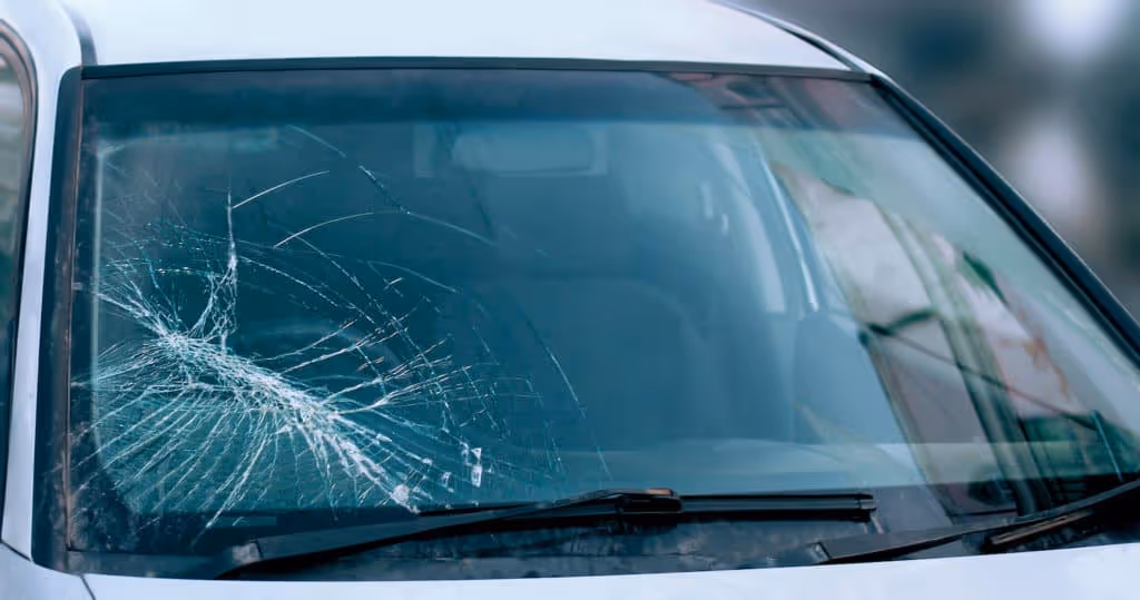 Ultimate Auto Glass Repair technician repairing a windshield